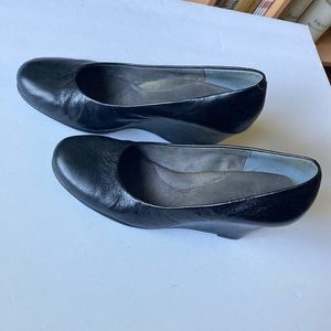 Aerosols, black with black leather upper, wedge dress shoes. Size 10 .